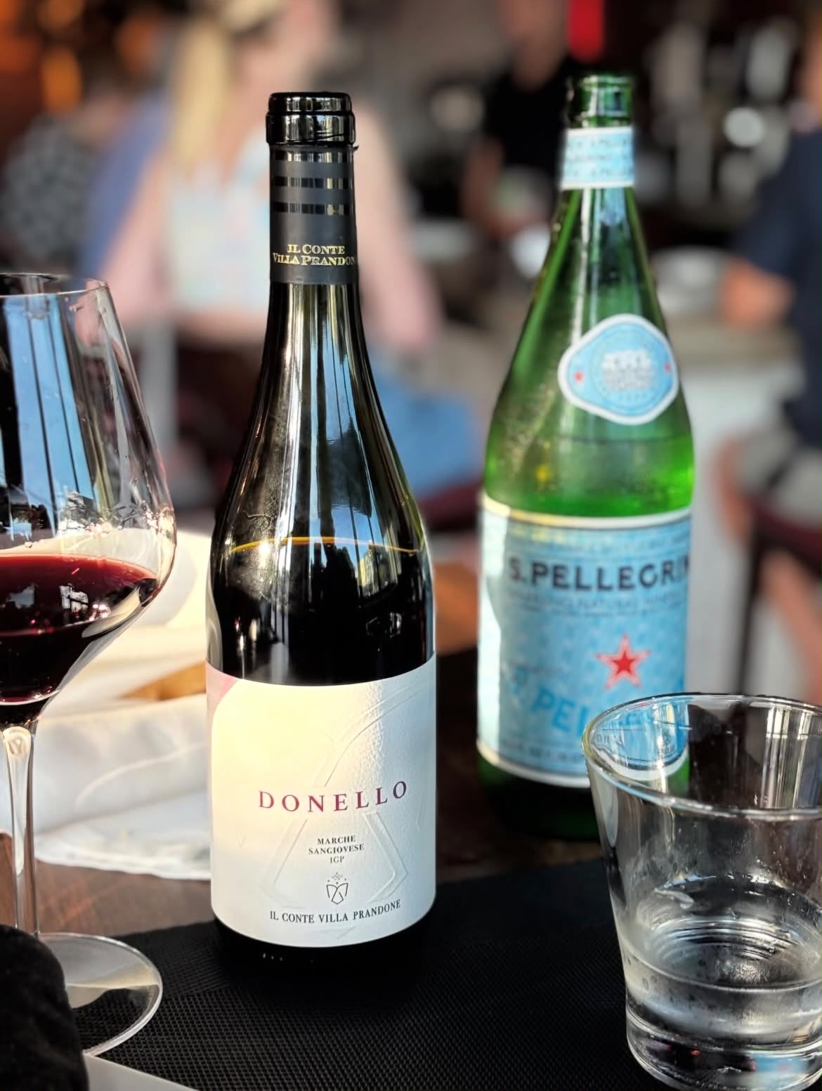 Donello wine bottle with wine glass on the table